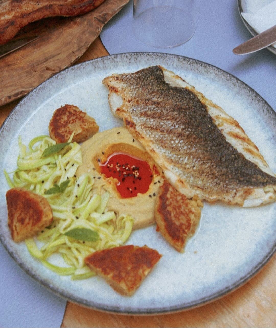 Sea bass on a bed of fava purée