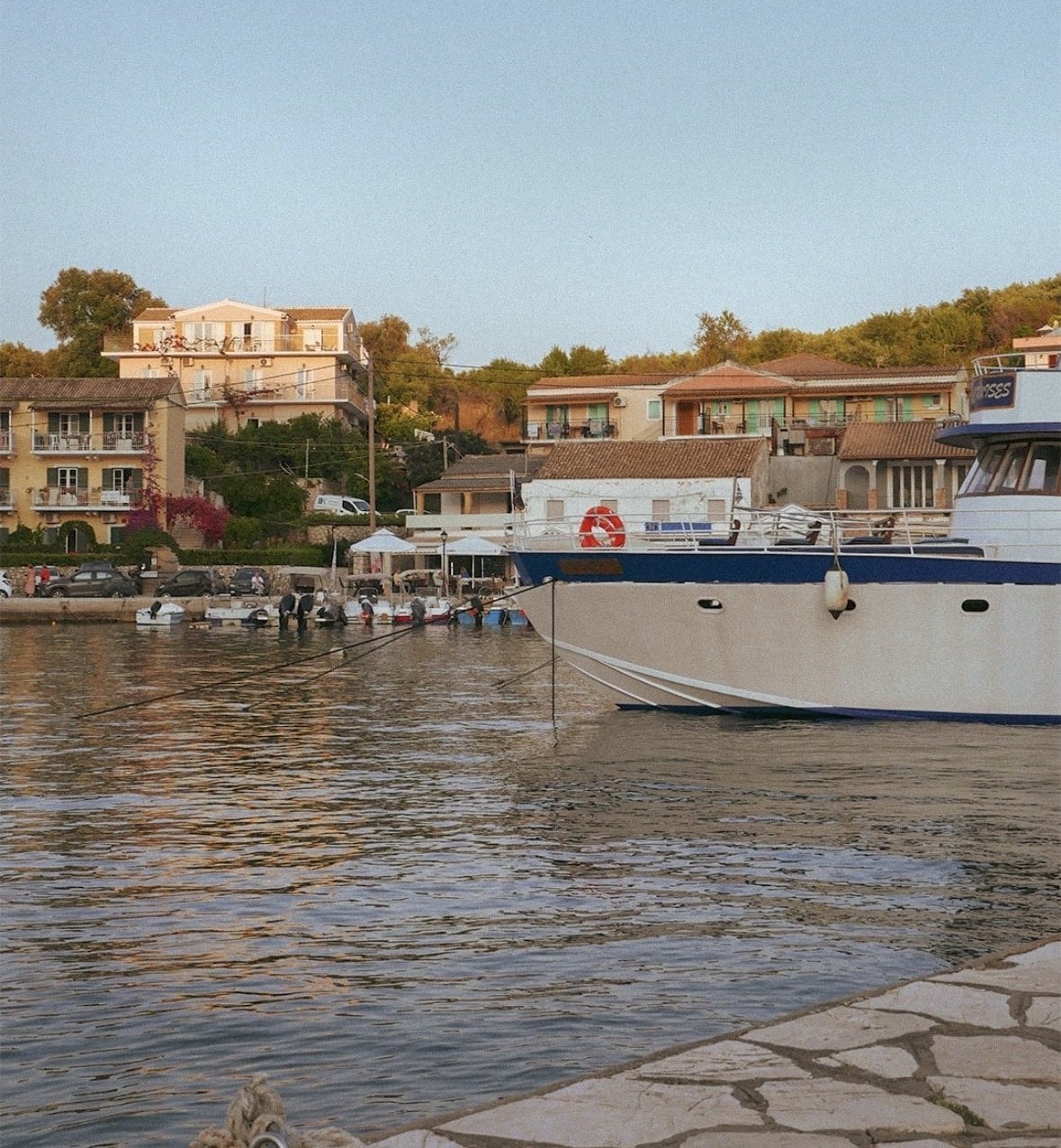 Kassiopi harbour glowing at golden hour
