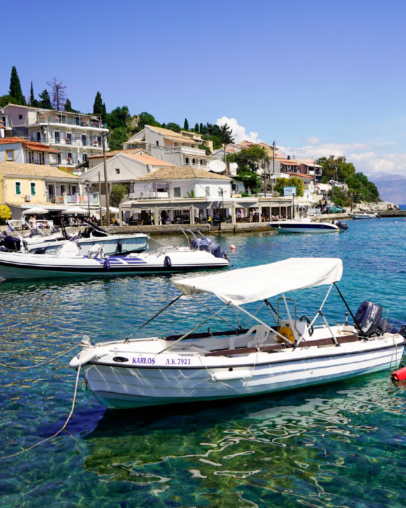 The same harbour water, the village beyond